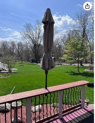Side-mounted umbrella on a deck railing